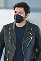 henry golding masks up for flight into nyc 04
