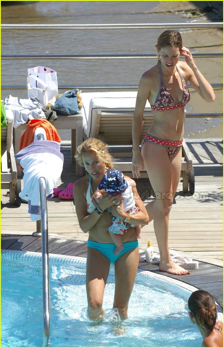 Sheryl Crow takes a dip in the pool with son Wyatt, 2 1/2 months, while vac...