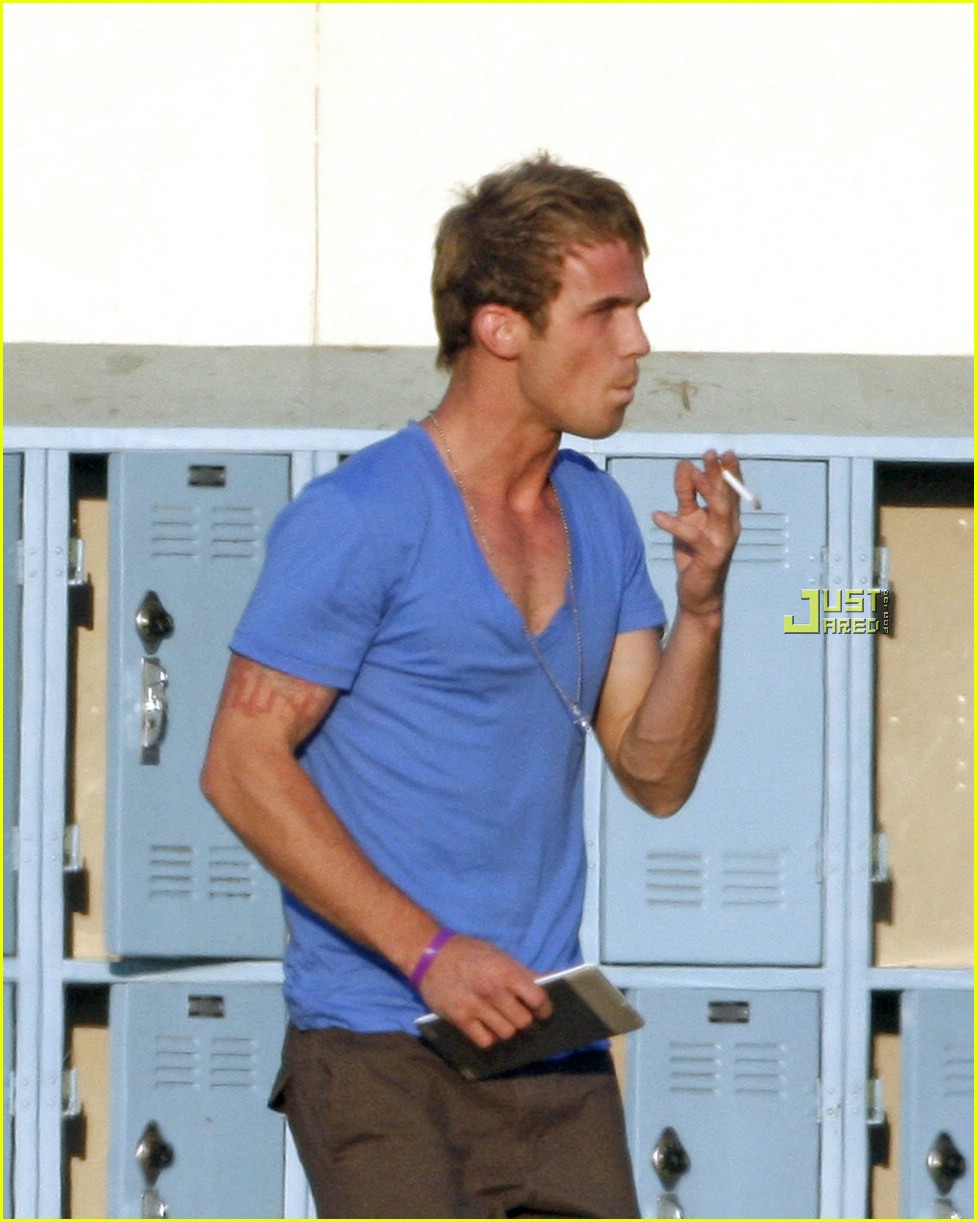 Cam Gigandet pulls up his shirt while on the set of his new film Easy A on ...