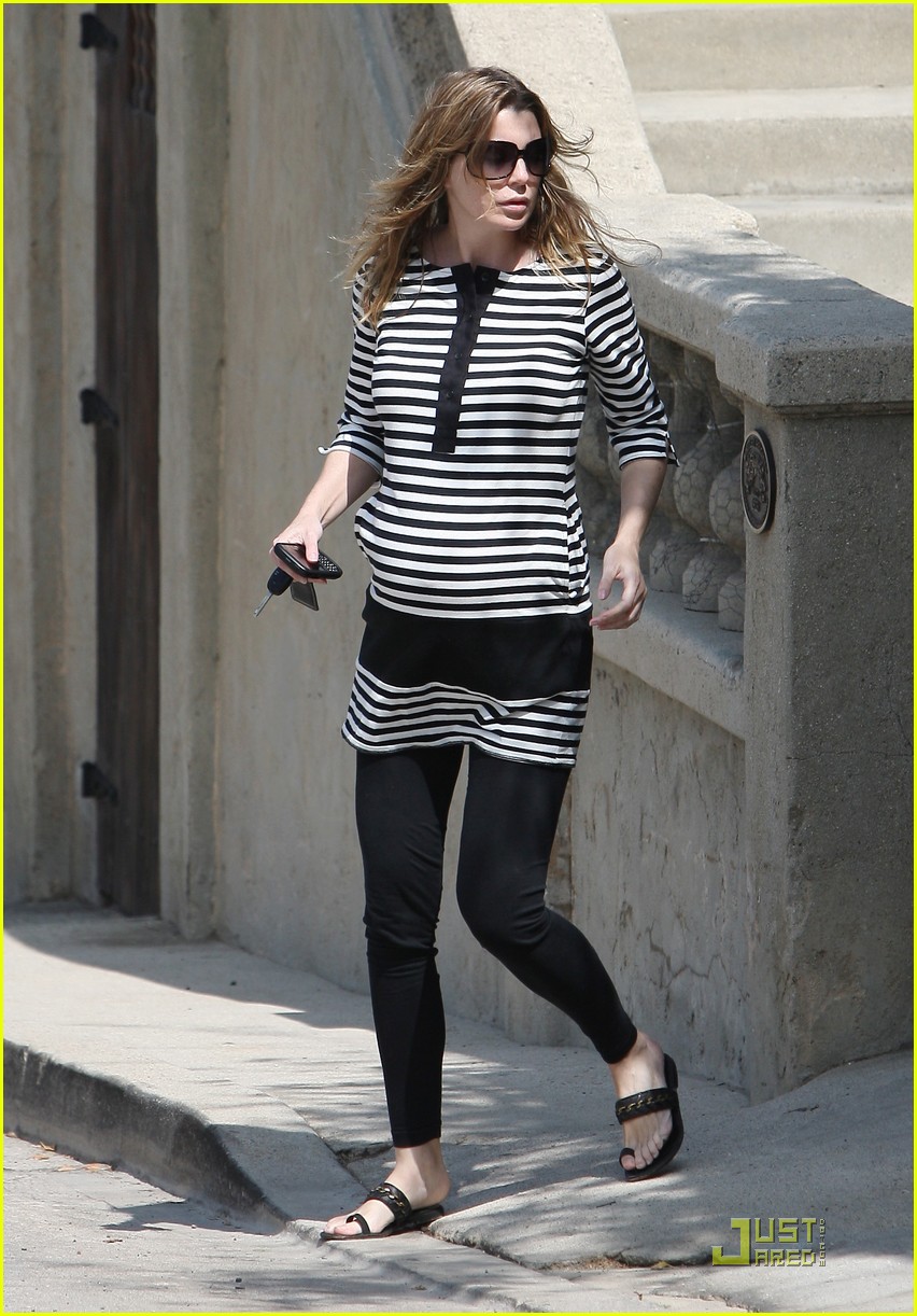 A very pregnant Ellen Pompeo wears a fun striped top as she leaves her Holl...