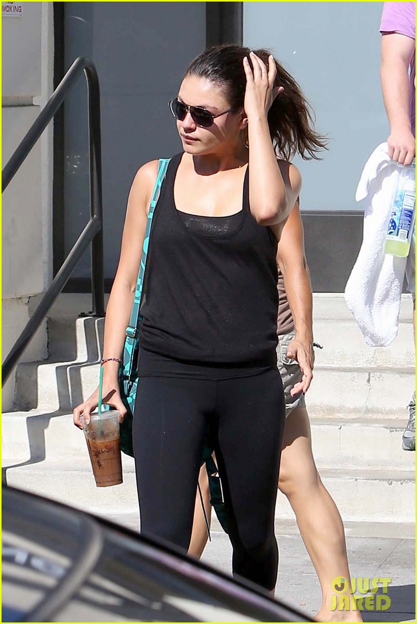 Mila Kunis shows off her toned tummy as she leaves a nail salon with a pal ...