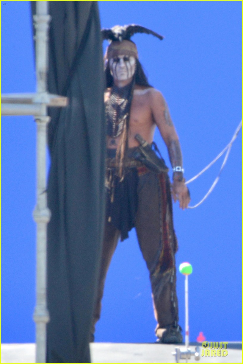 Johnny Depp goes shirtless as he shoots some scenes dressed in costume as T...