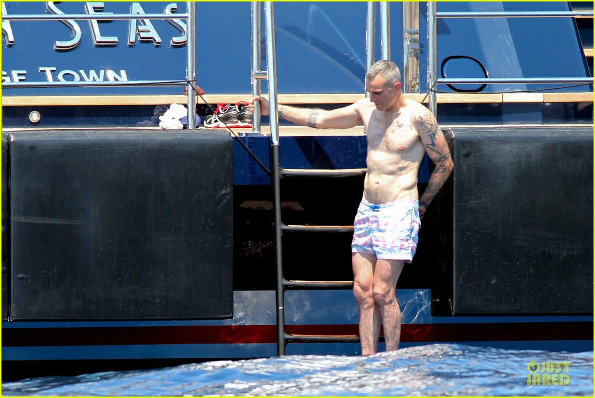 Daniel Day Lewis shows off his shirtless tattooed body while enjoying a vac...