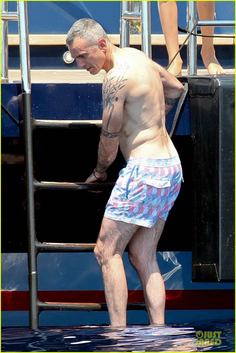 Daniel Day Lewis shows off his shirtless tattooed body while enjoying a vac...