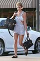 ashley greene shows white bra with overalls 03