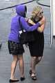 amy poehler playfully kisses aubrey plaza on parks rec set 05