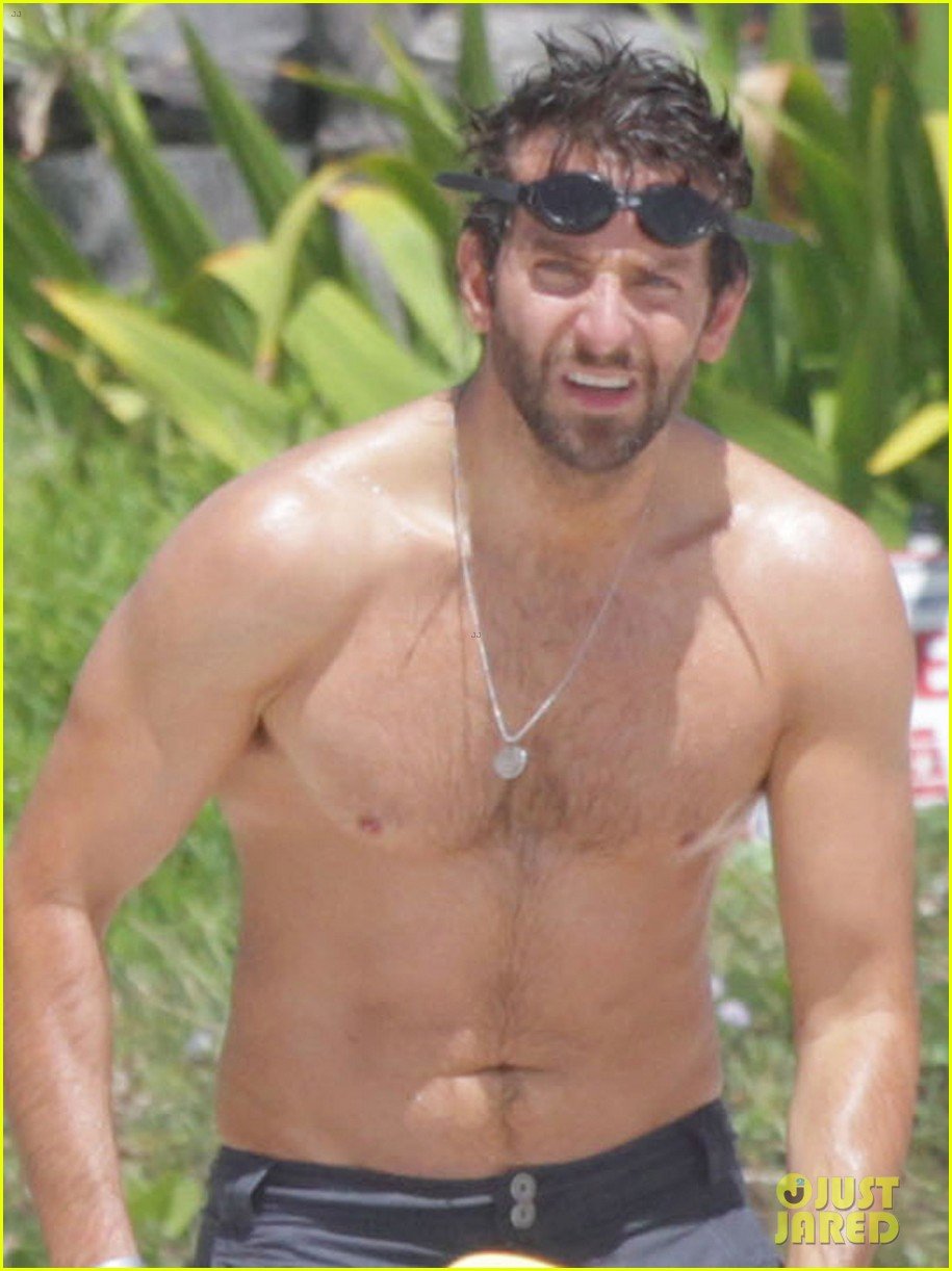 Bradley Cooper shows off his ripped shirtless physique while frolicking in ...