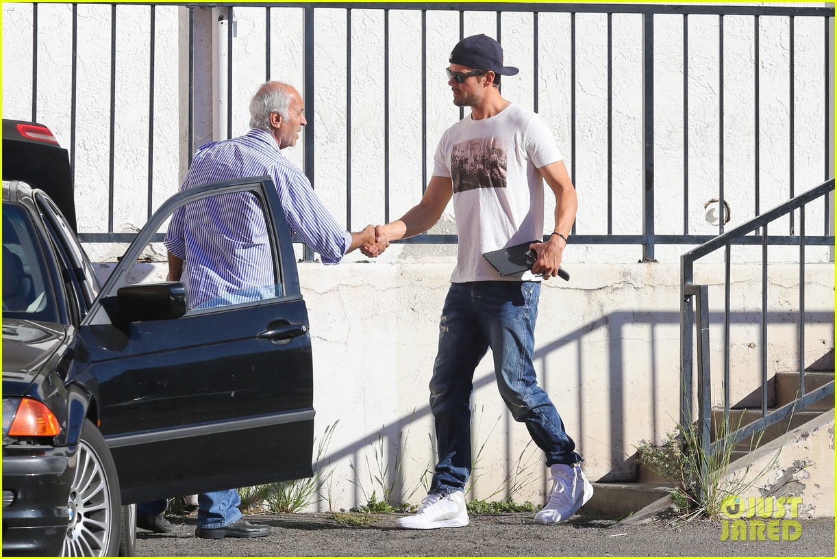 Josh Duhamel Cuddles Up to Son Axl to Watch Sunday Football! Photo