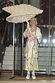 lady gaga carries large seashell umbrella around london 03