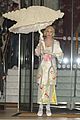 lady gaga carries large seashell umbrella around london 05