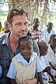 gerard butler visits liberia with marys meals all the photos 04