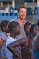 gerard butler visits liberia with marys meals all the photos 08