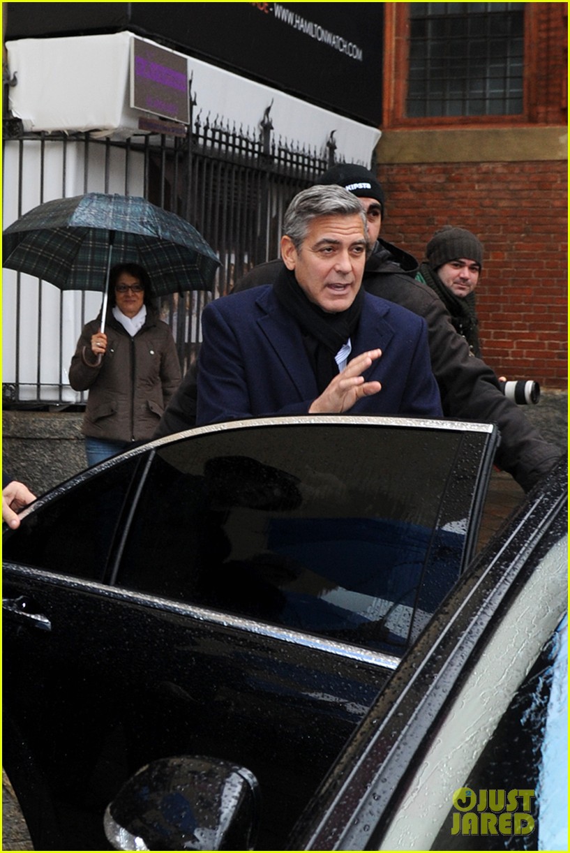 Matt Damon & Clooney Get Personal Umbrella Holders in Milan