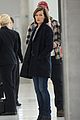 milla jovovich survivor cuts at heathrow airport 08