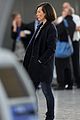 milla jovovich survivor cuts at heathrow airport 11