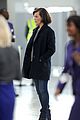 milla jovovich survivor cuts at heathrow airport 13