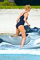 charlize therons bathing suit body is so enviable during jet ski shoot 05