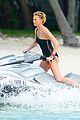 charlize therons bathing suit body is so enviable during jet ski shoot 11