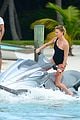 charlize therons bathing suit body is so enviable during jet ski shoot 14