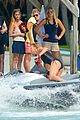 charlize therons bathing suit body is so enviable during jet ski shoot 17