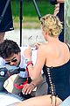 charlize therons bathing suit body is so enviable during jet ski shoot 18