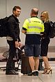 sam worthington lara bingle sydney airport departure 01