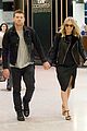 sam worthington lara bingle sydney airport departure 03