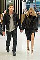 sam worthington lara bingle sydney airport departure 05