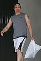 jeremy renner bulging biceps superhero workout 09