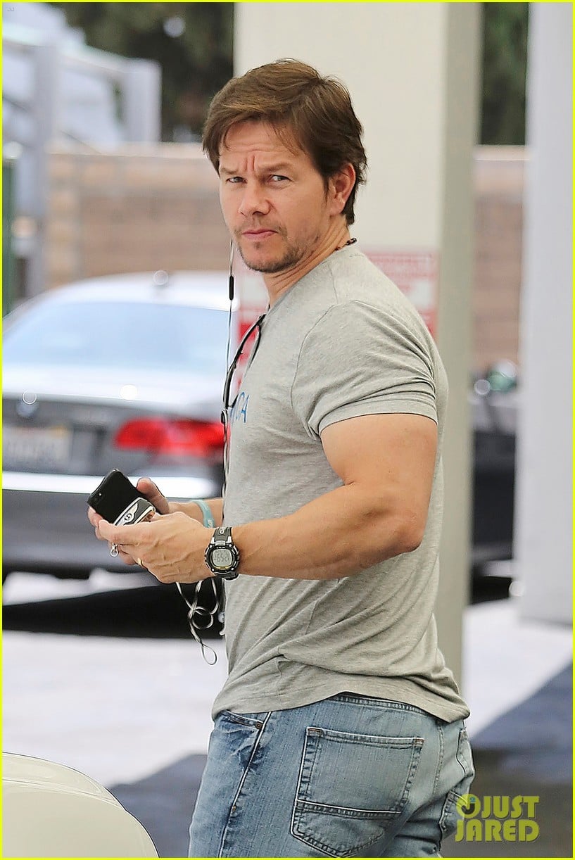 Mark Wahlberg's biceps are unbelievably huge as he gets his car from t...