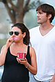 ashton kutcher plants a sweet kiss on pregnant mila kunis 04