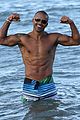 shemar moore shirtless flexes muscles beach 10