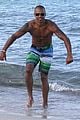 shemar moore shirtless flexes muscles beach 11