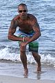 shemar moore shirtless flexes muscles beach 12