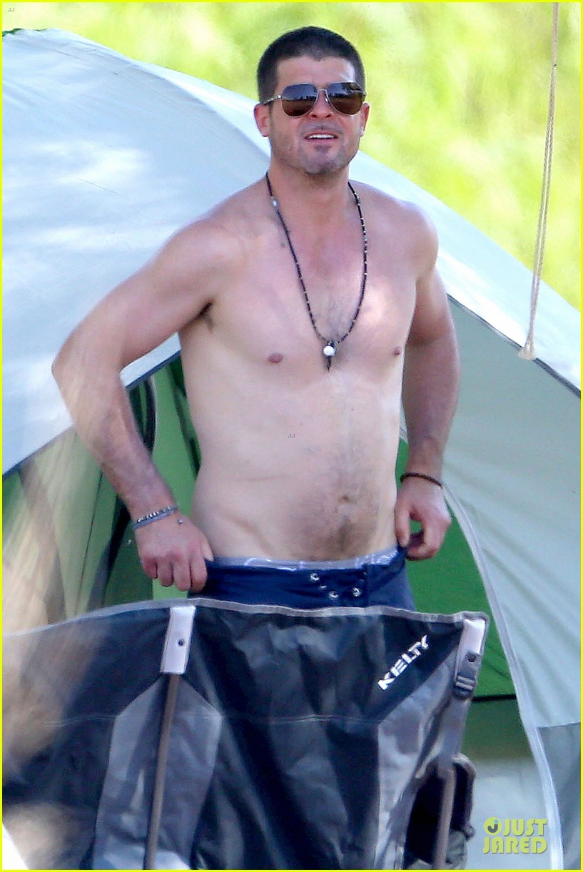 Robin Thicke shows off his shirtless body while enjoying the great outdoors...