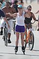 reese witherspoon gets around beach by rollerblading 03