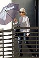 jennifer lawrence gives the middle finger with her umbrella 01