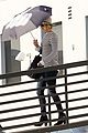 jennifer lawrence gives the middle finger with her umbrella 05