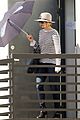 jennifer lawrence gives the middle finger with her umbrella 08