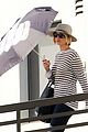 jennifer lawrence gives the middle finger with her umbrella 11