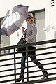 jennifer lawrence gives the middle finger with her umbrella 12