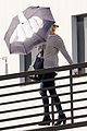 jennifer lawrence gives the middle finger with her umbrella 15