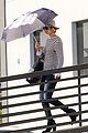 jennifer lawrence gives the middle finger with her umbrella 17