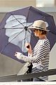 jennifer lawrence gives the middle finger with her umbrella 21