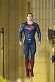 henry cavill hangs in the air in superman costume 01