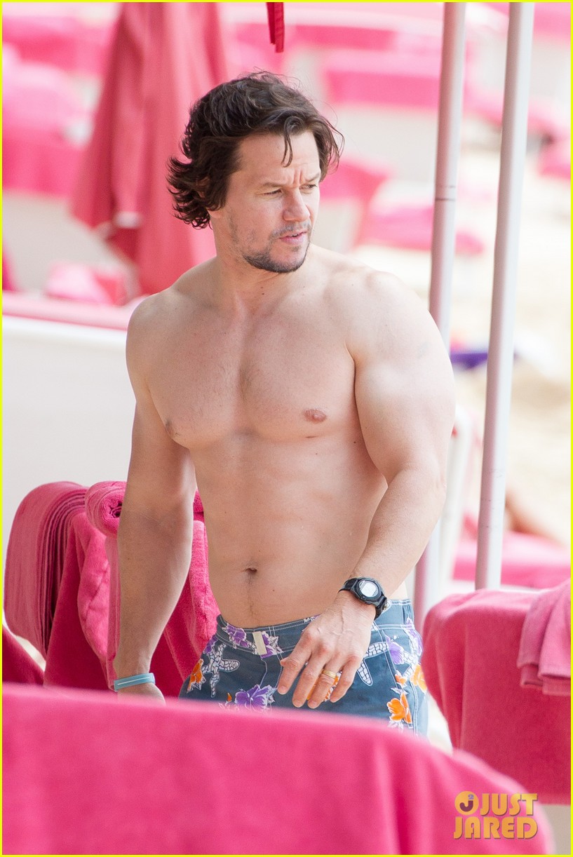Mark Wahlberg emerges from the water showing off his hot body during vacati...