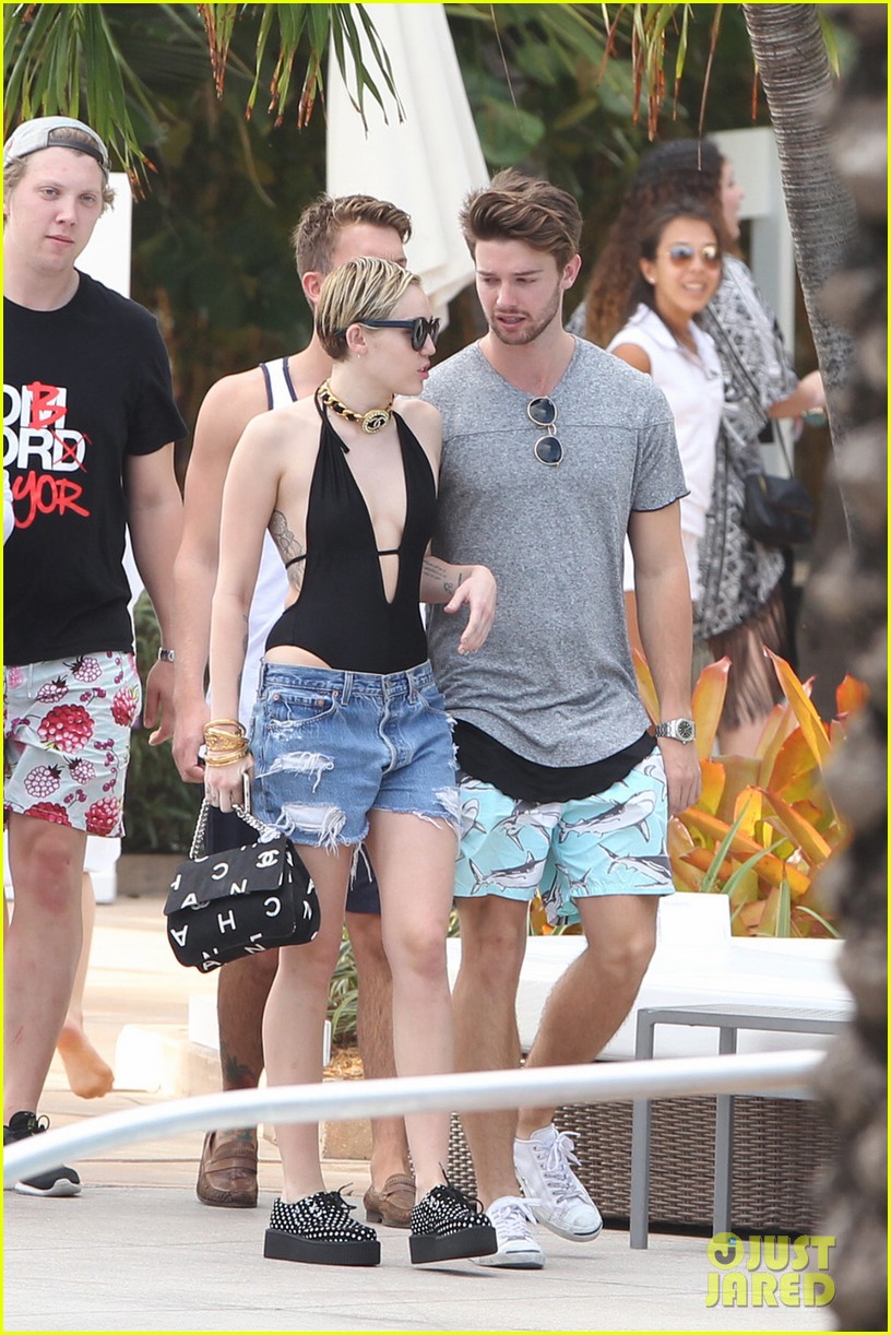 Miley Cyrus & Patrick Schwarzenegger Get Flirty Poolside in Miami with(02)