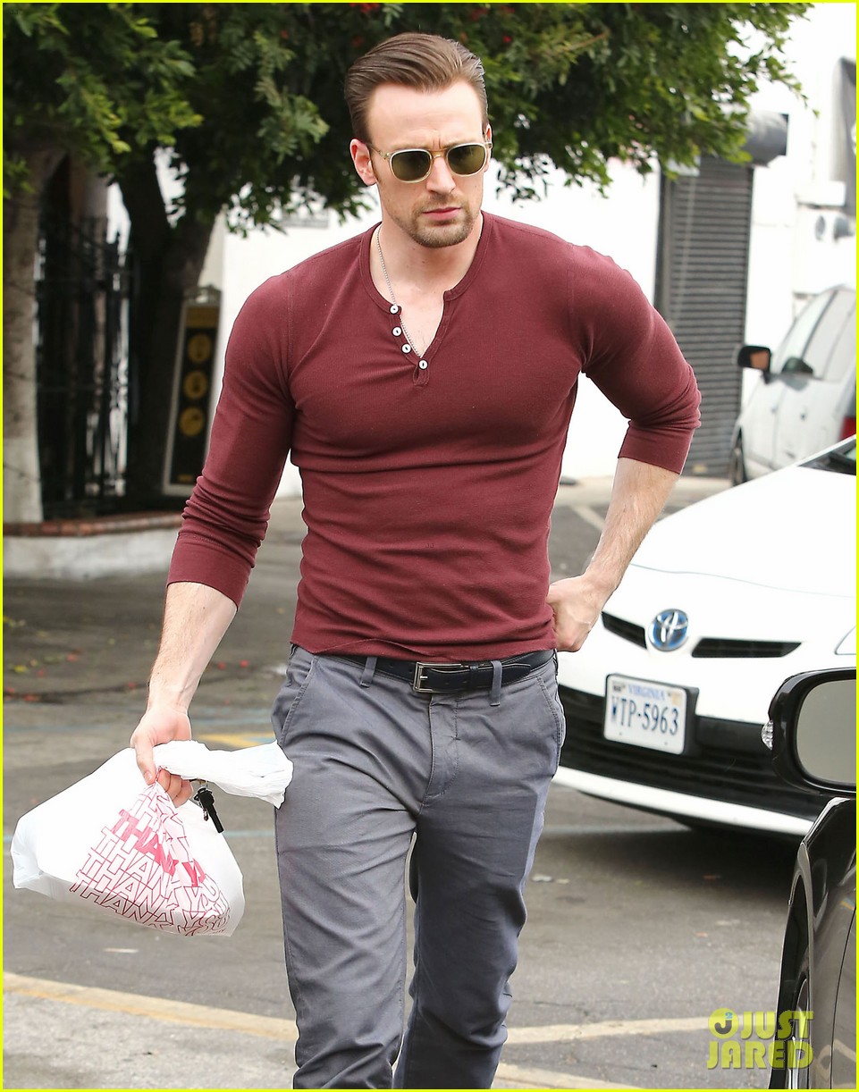 Chris Evans shows off his muscles in a tight shirt while exiting El Compadr...