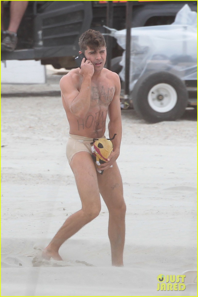 Zac Efron Runs Around Shirtless & Nearly Naked in These Amazing Pho...