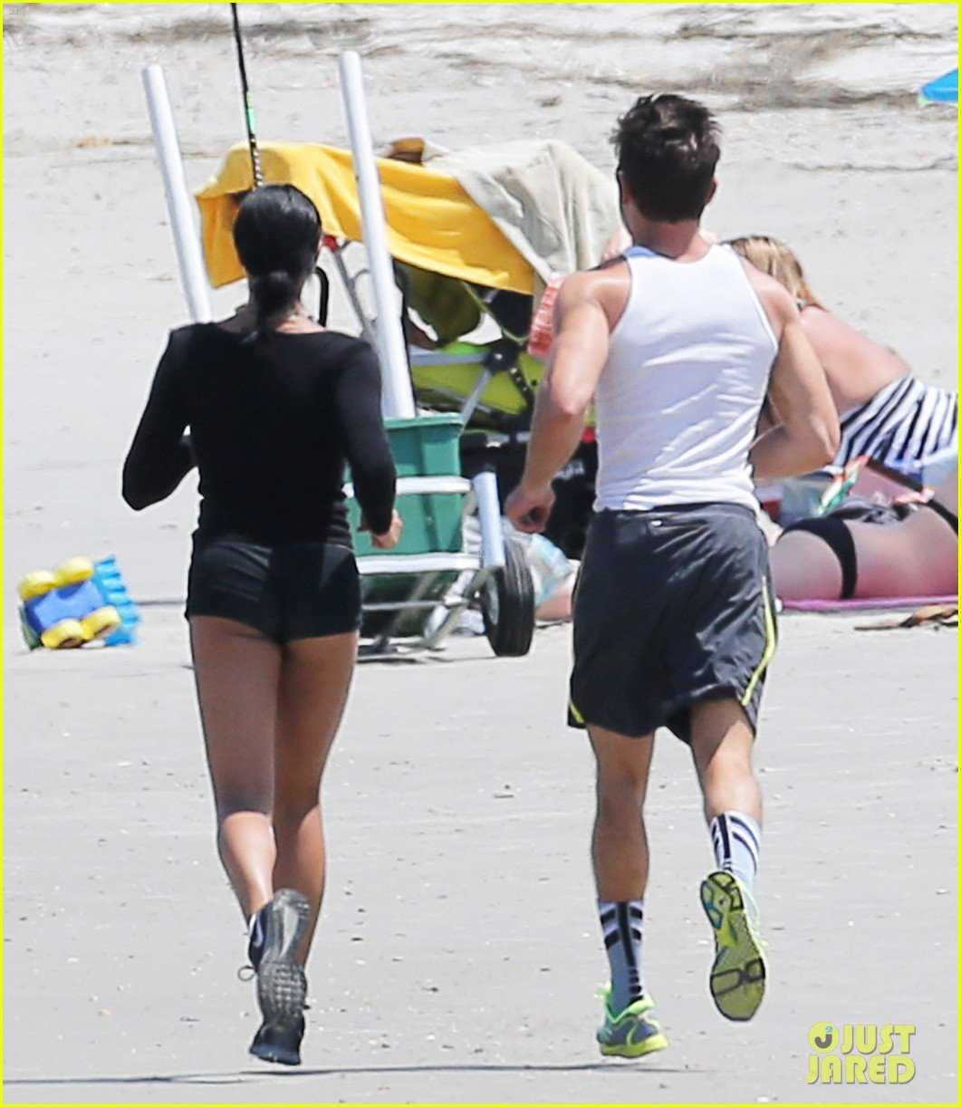 zac efron sami miro work our together on the beach 033362208
